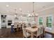 Eat-in kitchen featuring stainless appliances, large island, and access to the deck at 1141 Barley Stone Way, Raleigh, NC 27603