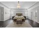 Spacious main bedroom with tray ceiling, chandelier, and decorative rug at 1141 Barley Stone Way, Raleigh, NC 27603
