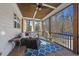 Relaxing screened-in porch with comfortable seating, wood ceiling, and a view of the backyard at 1141 Barley Stone Way, Raleigh, NC 27603