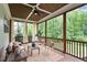 Inviting screened porch with wood ceiling, curtains and comfortable seating at 1141 Barley Stone Way, Raleigh, NC 27603