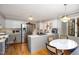 Functional kitchen featuring stainless steel appliances, white cabinets, and breakfast nook perfect for casual dining at 1205 Glen Eden Dr, Raleigh, NC 27612