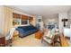 Bright living room with large window, comfortable sofa, and hardwood floors leading to the dining area at 1205 Glen Eden Dr, Raleigh, NC 27612