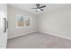 Bedroom with neutral walls, carpeted floor and large window with a nature view at 125 Sue-Kim Dr, Youngsville, NC 27596