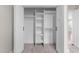 Open white closet featuring shelving and clothing rods, enhancing storage capacity at 125 Sue-Kim Dr, Youngsville, NC 27596