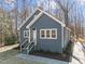 Charming single-story house with gray siding, white trim, inviting front entrance, and well-maintained landscaping at 125 Sue-Kim Dr, Youngsville, NC 27596