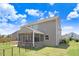 Exterior of a two-story home featuring a screened porch, fenced area, and well-manicured lawn at 130 Daniel Farm Dr, Benson, NC 27504