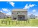Back of the house with an enclosed porch, fenced area, and grill at 130 Daniel Farm Dr, Benson, NC 27504