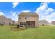 Large, level backyard with a screened in porch and patio at 130 Daniel Farm Dr, Benson, NC 27504
