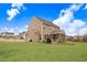 The lush backyard features a screened porch and extended patio at 130 Daniel Farm Dr, Benson, NC 27504