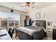 Bedroom with natural light from the window and stylish dark furniture at 130 Daniel Farm Dr, Benson, NC 27504