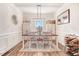 Elegant dining room featuring a farmhouse table and chandelier at 130 Daniel Farm Dr, Benson, NC 27504