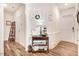 Inviting entryway features wood flooring, white trim, and decorative console table with stylish accents at 130 Daniel Farm Dr, Benson, NC 27504