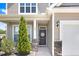 Inviting front entrance with decorative door, stone accents, and well-maintained landscaping at 130 Daniel Farm Dr, Benson, NC 27504