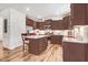 Stylish kitchen featuring granite countertops, stainless appliances, and an island with seating, perfect for entertaining at 130 Daniel Farm Dr, Benson, NC 27504