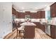 Modern kitchen boasts stainless steel appliances, an island with seating, and ample cabinet space at 130 Daniel Farm Dr, Benson, NC 27504