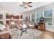 Open-concept living room seamlessly connects to the kitchen, offering abundant natural light and stylish furnishings at 130 Daniel Farm Dr, Benson, NC 27504