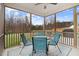 Relax on this screened in porch, overlooking the level backyard at 130 Daniel Farm Dr, Benson, NC 27504