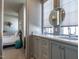 Bathroom featuring a vanity with double sinks, and a view into the bedroom at 1324 Brooks Ave, Raleigh, NC 27607