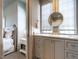 Bathroom featuring a vanity, undermount sink, and a view into the bedroom at 1324 Brooks Ave, Raleigh, NC 27607