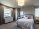 Bedroom featuring a double bed, side tables, and dresser with plenty of storage space at 1324 Brooks Ave, Raleigh, NC 27607