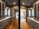 Chic butler's pantry with custom cabinetry, marble countertops, and elegant lighting, adding luxury to the home at 1324 Brooks Ave, Raleigh, NC 27607