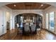 Open dining room with wood flooring, wood plank ceiling, and an elegant modern chandelier at 1324 Brooks Ave, Raleigh, NC 27607