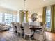 Elegant dining room features a chandelier, hardwood floors, and plush seating, perfect for entertaining at 1324 Brooks Ave, Raleigh, NC 27607