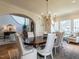 Formal dining room with a long table, chandelier, and hardwood floors, perfect for hosting gatherings at 1324 Brooks Ave, Raleigh, NC 27607