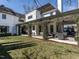 Elegant two-story home featuring a lush green lawn and a charming covered patio at 1324 Brooks Ave, Raleigh, NC 27607