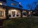 Expansive backyard patio featuring an outdoor kitchen, dining, and living area at 1324 Brooks Ave, Raleigh, NC 27607