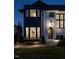 Stunning two-story home with a charming front entrance, large windows, and manicured landscaping at 1324 Brooks Ave, Raleigh, NC 27607