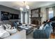Comfortable living room featuring a fireplace, piano, built-in shelving and cabinets, and recessed lighting at 1324 Brooks Ave, Raleigh, NC 27607