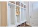 White built-in cubbies with baskets and a bench at 2101 Amalfi Pl, Apex, NC 27502