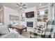 Open living room with built-ins, fireplace, and comfortable seating at 2101 Amalfi Pl, Apex, NC 27502