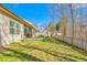 Landscaped backyard with shed and wooden fence at 2242 Colorado Dr, Graham, NC 27253
