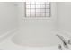 Relaxing bathroom with a soaking tub and a window at 2242 Colorado Dr, Graham, NC 27253