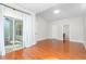 Main bedroom with hardwood floors and access to a patio at 2242 Colorado Dr, Graham, NC 27253