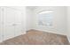 Bright bedroom with carpeted floors and double doors at 2242 Colorado Dr, Graham, NC 27253