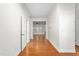 Bright hallway with hardwood floors leading to living areas at 2242 Colorado Dr, Graham, NC 27253