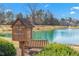 Community Little Free Library by a pond at 2242 Colorado Dr, Graham, NC 27253