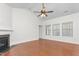 Living room with hardwood floors, fireplace and large windows at 2242 Colorado Dr, Graham, NC 27253