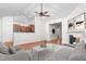 Inviting living room featuring hardwood floors, a ceiling fan, fireplace and an open view to the kitchen at 2242 Colorado Dr, Graham, NC 27253