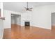 Spacious living room with hardwood floors, a fireplace, and a view into other rooms of the home at 2242 Colorado Dr, Graham, NC 27253