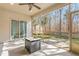 Screened porch with fire pit and backyard view at 2242 Colorado Dr, Graham, NC 27253