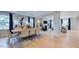 Open concept dining room and living area with hardwood floors at 246 Tidal Pool Way, Cary, NC 27519