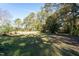 Large backyard with a hammock and wooden fence at 248 Southgate Dr, Garner, NC 27529