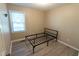 Simple bedroom with a metal frame bed and hardwood floors at 248 Southgate Dr, Garner, NC 27529