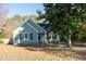 Green house with black shutters and landscaping at 248 Southgate Dr, Garner, NC 27529