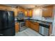 Modern kitchen with stainless steel appliances and wood cabinets at 248 Southgate Dr, Garner, NC 27529