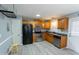 Modern kitchen with stainless steel appliances and wood cabinets at 248 Southgate Dr, Garner, NC 27529